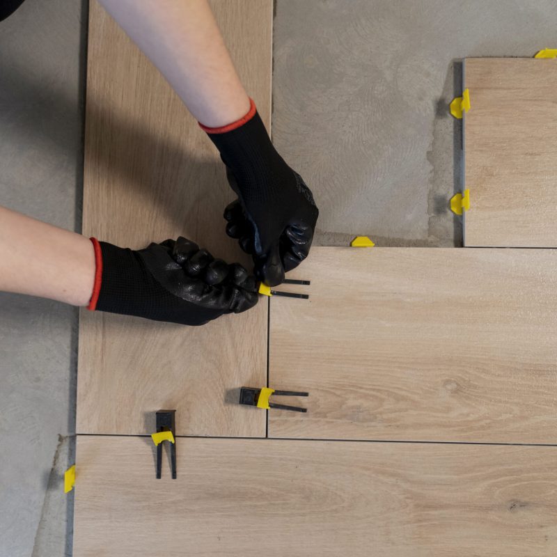 flat-lay-worker-tiling-floor